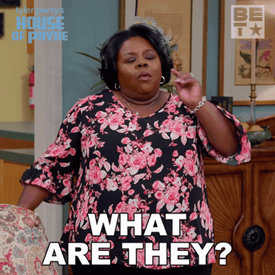 Woman In Floral Shirt Asking What Are They GIF