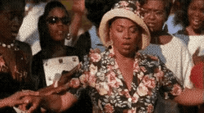 Woman In Floral Shirt Holding Hands GIF