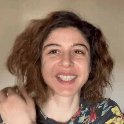 Woman In Floral Shirt Smiling GIF