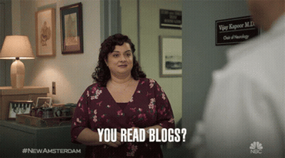 Woman In Floral Shirt You Read Blogs GIF