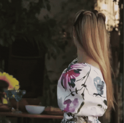 Woman In Floral Top GIF