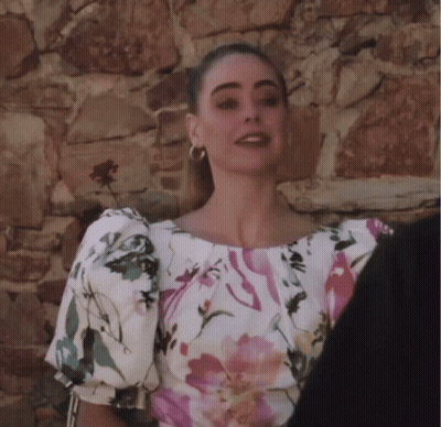 Woman In Floral Top With Puffed Sleeves GIF