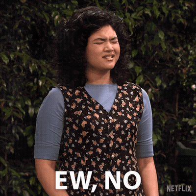 Woman In Floral Vest Making Funny Face Saying Ew No GIF