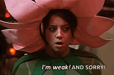 Woman In Flower Costume Says I'm Weak And Sorry GIF