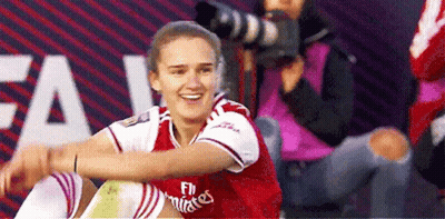 Woman In Fly Emirates Jersey Smiling GIF