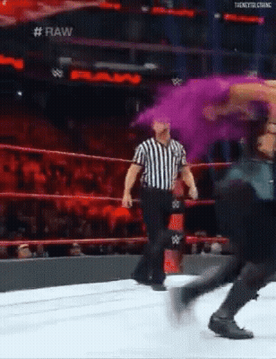 Woman In Front Of All Elite AEW Sign GIF