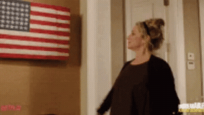 Woman in Front of American Flag