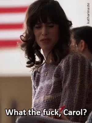 Woman In Front Of American Flag Saying What The Fuck Carol GIF