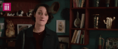 Woman In Front Of Bookshelf With BBC GIF