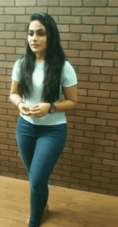 Woman In Front Of Brick Wall GIF