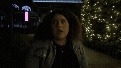 Woman In Front Of Building Saying Move GIF