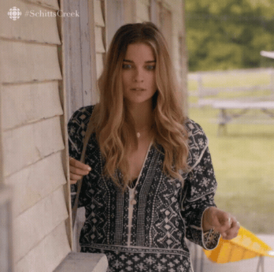 Woman In Front Of Building Schitts Creek GIF