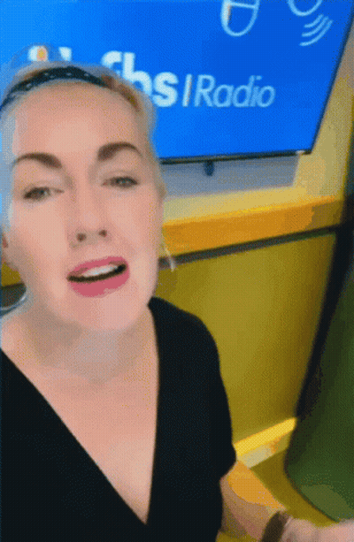 Woman In Front Of CBS Radio Screen GIF