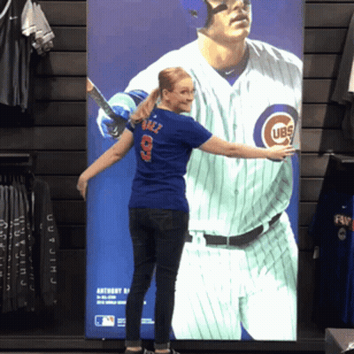 Woman In Front Of Cubs Baseball Poster GIF
