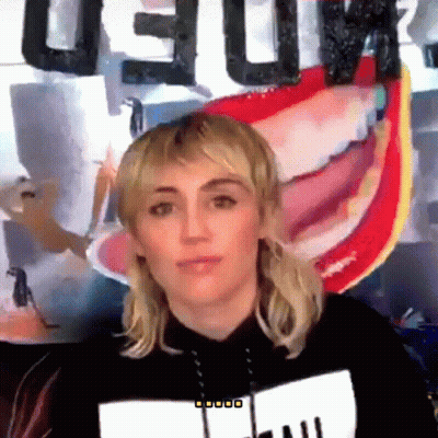 Woman In Front Of Deluxe Sign GIF