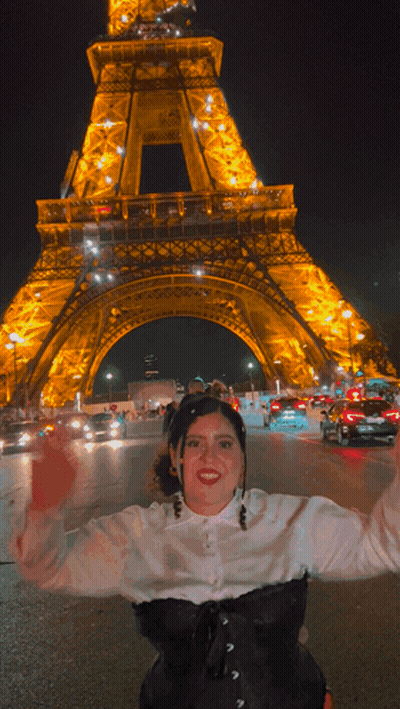 Woman In Front Of Eiffel Tower At Night GIF