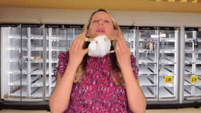 Woman In Front Of Empty Refrigerators With 3.99 Sign GIF