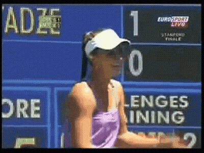 Woman In Front Of Eurosport Live Scoreboard GIF