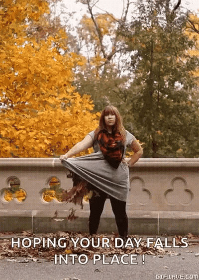Woman In Front Of Fence Hoping Your Day Falls Into Place GIF