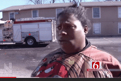 Woman In Front Of Fire Truck With Number 6 On Shirt GIF