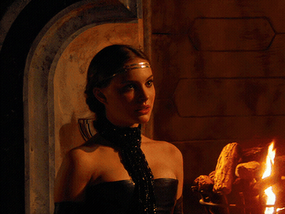 Woman In Front Of Fireplace With Headband And Gloves GIF