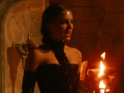 Woman In Front Of Fireplace With Headband GIF