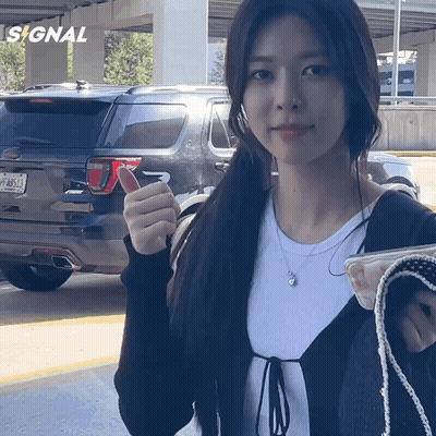 Woman In Front Of Ford Explorer GIF