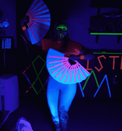 Woman In Front Of Glow In The Dark Sign Saying Isti GIF