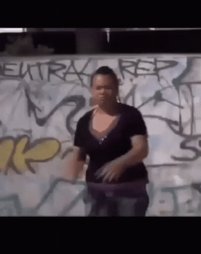 Woman In Front Of Graffiti Wall Saying Rep GIF