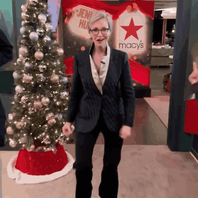 Woman In Front Of Macy's Sign GIF