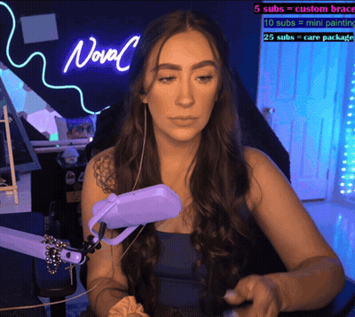 Woman In Front Of Neon Novel Sign GIF