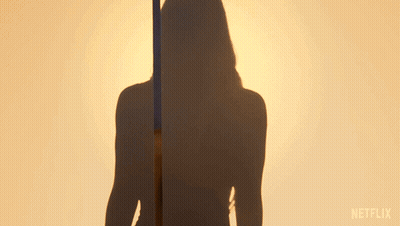Woman In Front Of Netflix Logo GIF