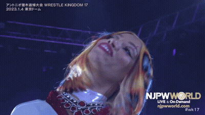 Woman In Front Of NJpwworld Live And On-Demand Sign GIF