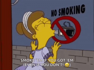 Woman in Front of No Smoking Sign