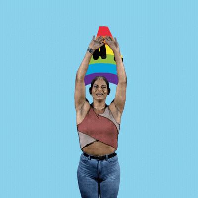 Woman In Front Of Rainbow Saying Equality GIF