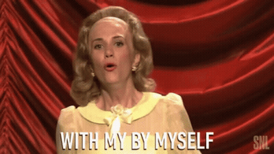 Woman In Front Of Red Curtain Saying With My By Myself GIF