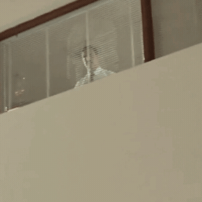 Woman In Front Of Rehab Center Wall GIF