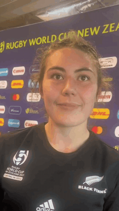 Woman In Front Of Rugby World Cup Banner GIF