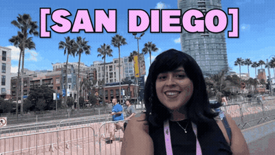 Woman In Front Of San Diego Sign GIF