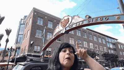 Woman In Front Of San Diego Sign GIF