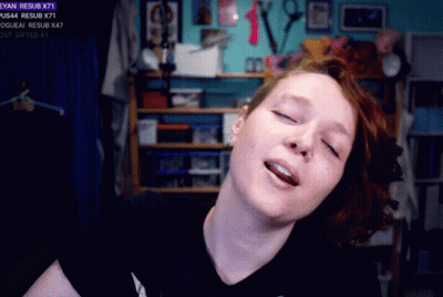 Woman In Front Of Screen Saying Resub X71 GIF