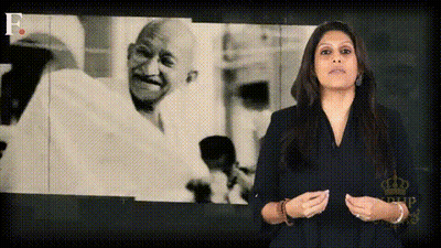 Woman In Front Of Screen With Mahatma Gandhi GIF
