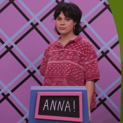 Woman In Front Of Sign Saying Anna GIF