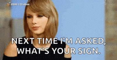 Woman In Front Of Sign Saying Next Time I'm Asked What's Your Sign GIF
