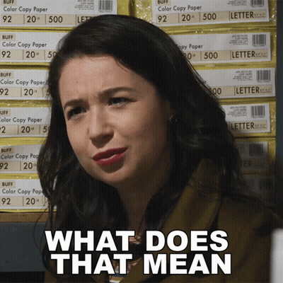 Woman In Front Of Stacks Of Buff Copy Paper GIF