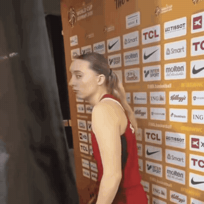 Woman in Front of TCL and Molten Wall