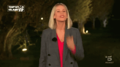 Woman In Front Of Temptation Island VIP Sign GIF