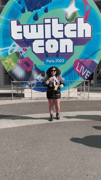 Woman In Front Of Twitch Con Sign GIF