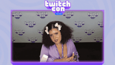 Woman In Front Of Twitch Con Wall GIF