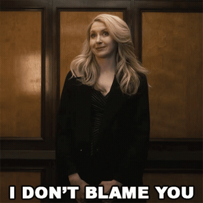 Woman In Front Of Wall Saying I Don't Blame You GIF